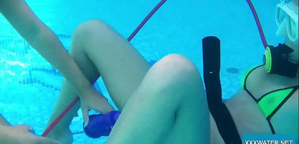  Two hot lesbians playing with dildos in the pool